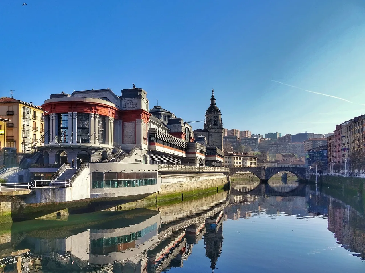A market hall and old buildings on the river