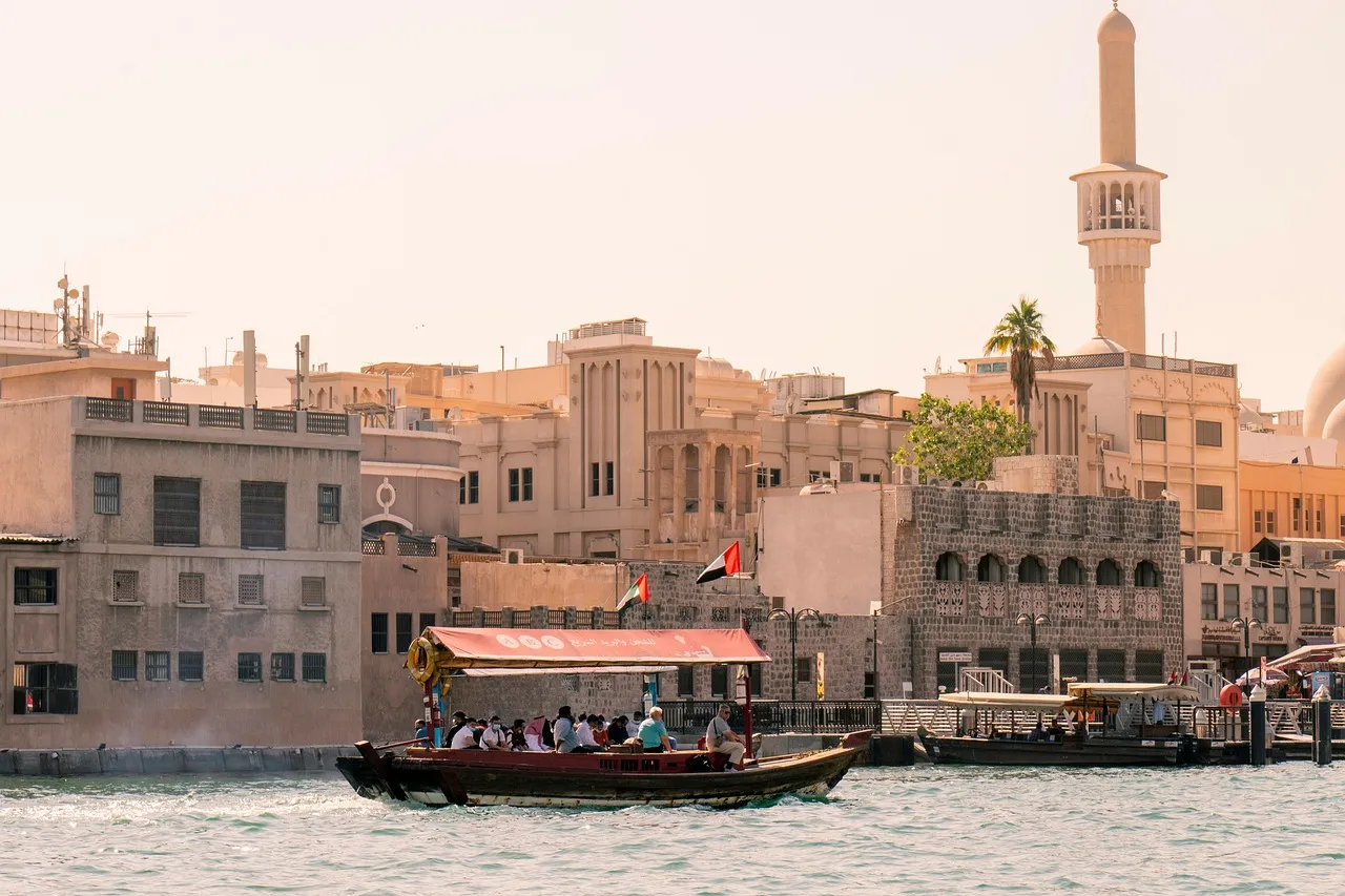 An abra crossing Dubai Creek past the old waterfront