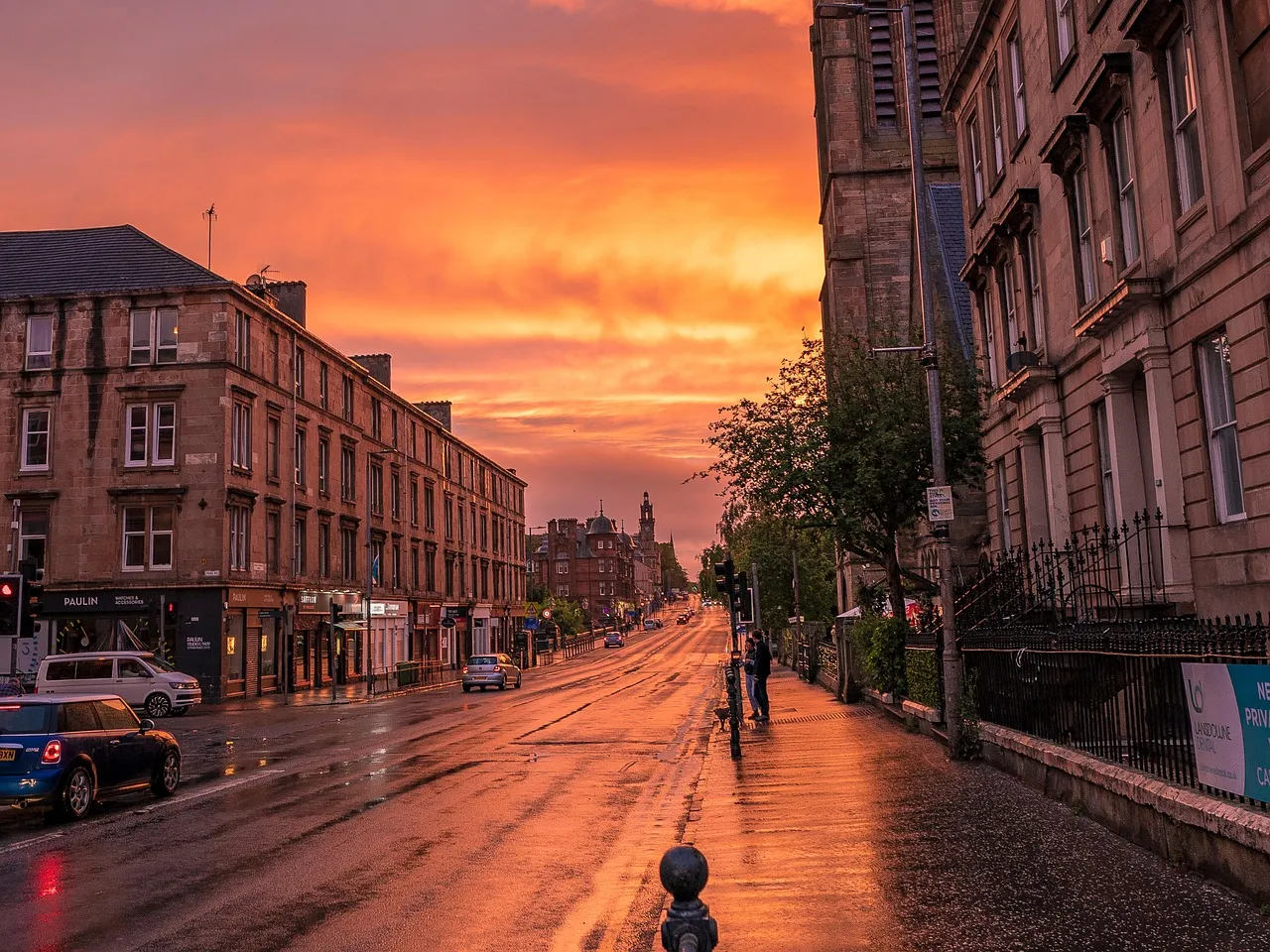 A street of sandstone tenements at sunset