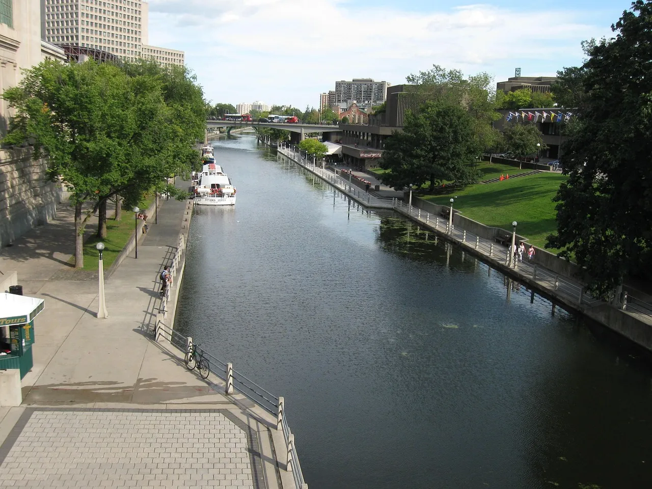 A canal lined with paths and trees