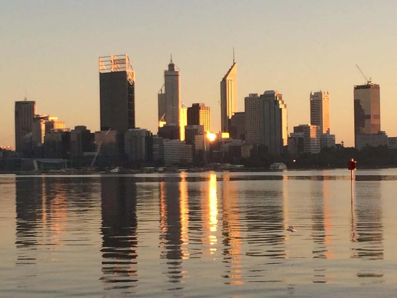 Perth’s skyline reflected in the river at dawn